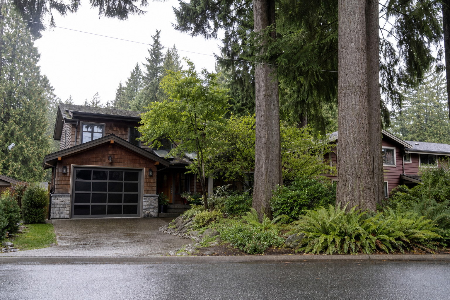 Cedar-clad split-level house in Lynn Valley with mature Douglas-fir trees in the yard, late-afternoon light on the front porch